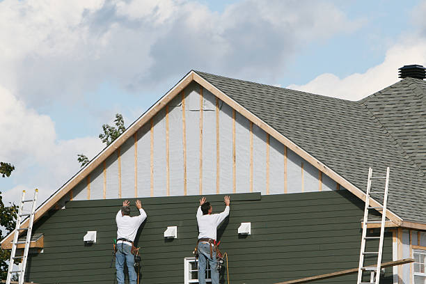 Professional Siding technician working in West River, MD